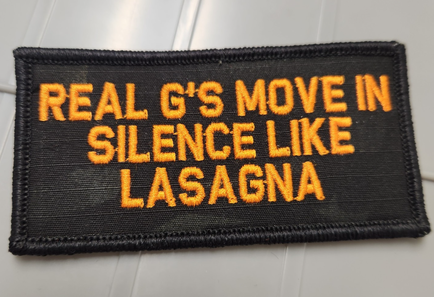 As Seen on Socials - Real G's Move In Silence Like Lasagna - 2x4 Patch - Black w/Orange